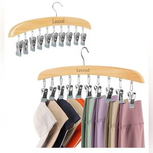 Wooden hanger with metal clips for closet organization